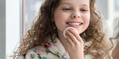 Tween Girl Doing Skincare in Mirror