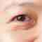 A close-up of a woman's eye.